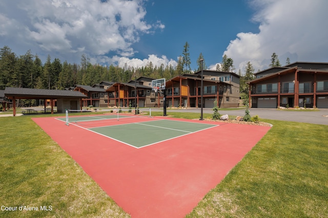 view of sport court with a lawn and tennis court