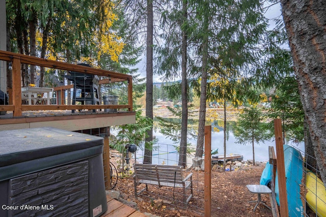 dock area featuring a deck with water view