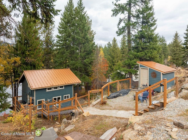 view of yard with a storage shed and a deck