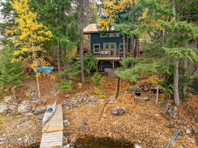 rear view of house with a wooden deck