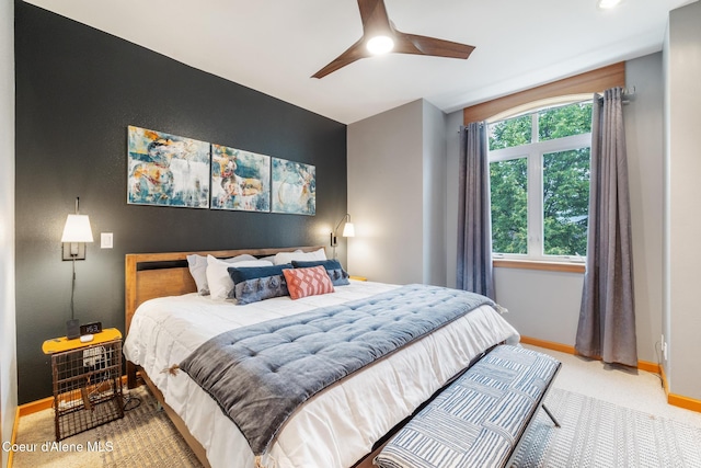 carpeted bedroom featuring ceiling fan