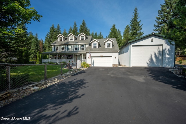 view of front of property featuring a garage and a front yard