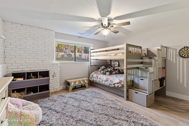 bedroom featuring light hardwood / wood-style flooring and ceiling fan