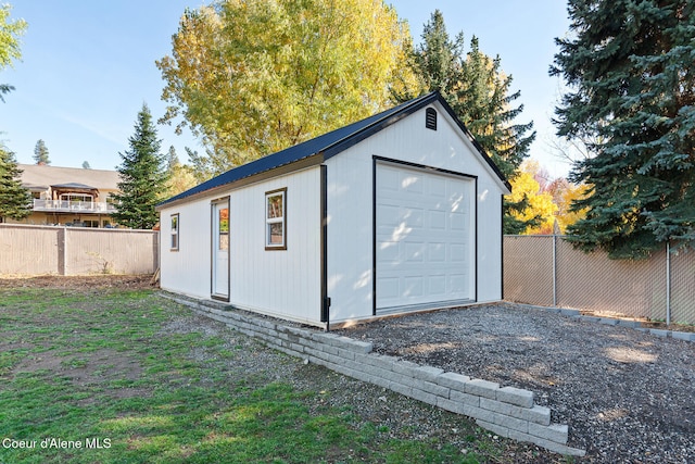 view of outbuilding featuring a garage