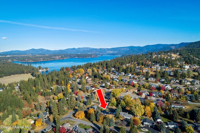 bird's eye view with a water and mountain view