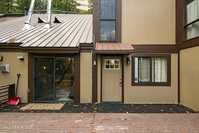 doorway to property with a wall mounted air conditioner