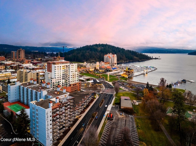 aerial view at dusk with a water view