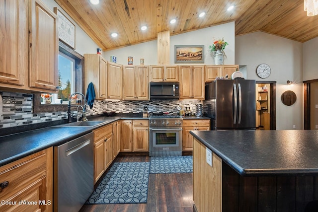 648 Curley Creek Rd, Moyie Springs, ID 83845 - kitchen with appliances with stainless steel finishes, a sink, dark countertops, dark wood-style flooring, and lofted ceiling