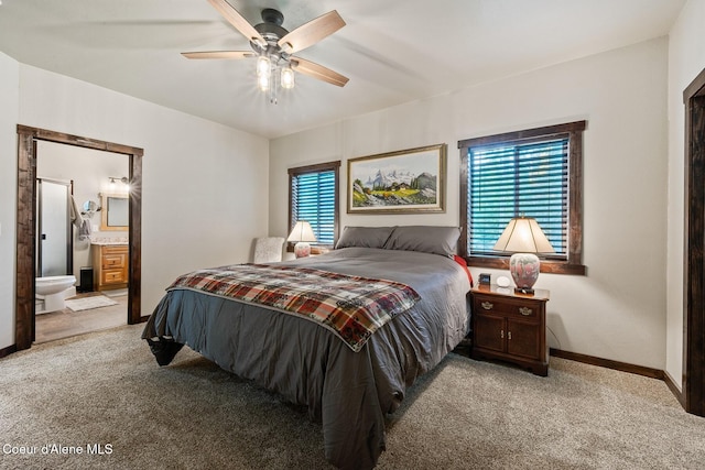 carpeted bedroom featuring connected bathroom and ceiling fan