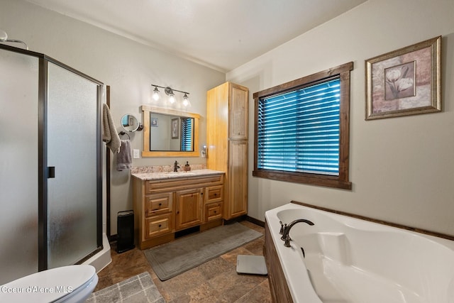 full bathroom featuring toilet, plus walk in shower, vanity, and tile patterned flooring