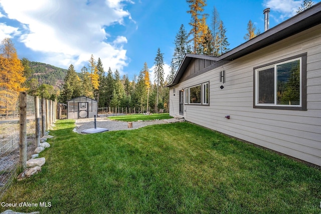 648 Curley Creek Rd, Moyie Springs, ID 83845 - view of yard with a storage unit and an outdoor structure