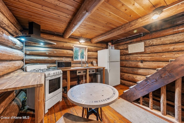 648 Curley Creek Rd, Moyie Springs, ID 83845 - kitchen with white appliances, butcher block countertops, a sink, beamed ceiling, and wooden ceiling