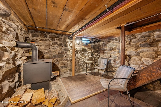 648 Curley Creek Rd, Moyie Springs, ID 83845 - finished basement featuring a wood stove and wooden ceiling