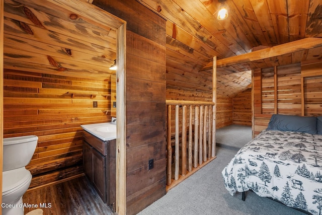 bedroom with dark hardwood / wood-style flooring, wood ceiling, wooden walls, and vaulted ceiling