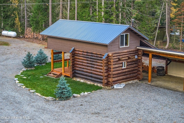 view of home's exterior with an outdoor structure