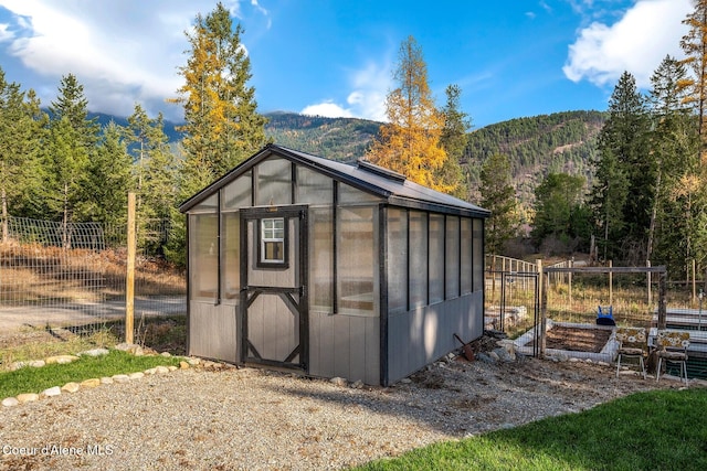 view of outbuilding featuring a mountain view