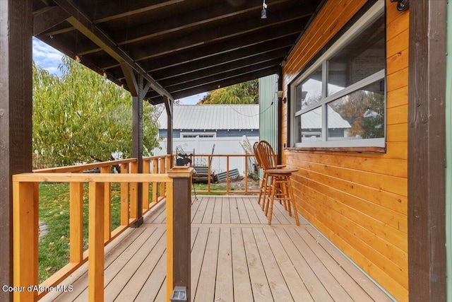 wooden deck featuring fence
