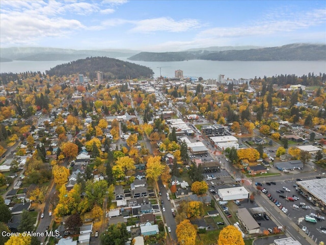 aerial view of property's location featuring a water and mountain view