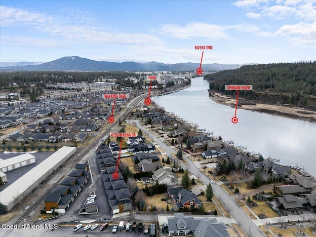 aerial view featuring a water and mountain view