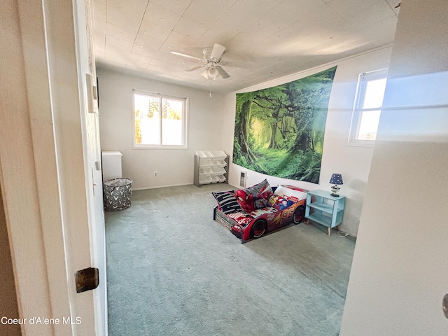 carpeted bedroom with ceiling fan