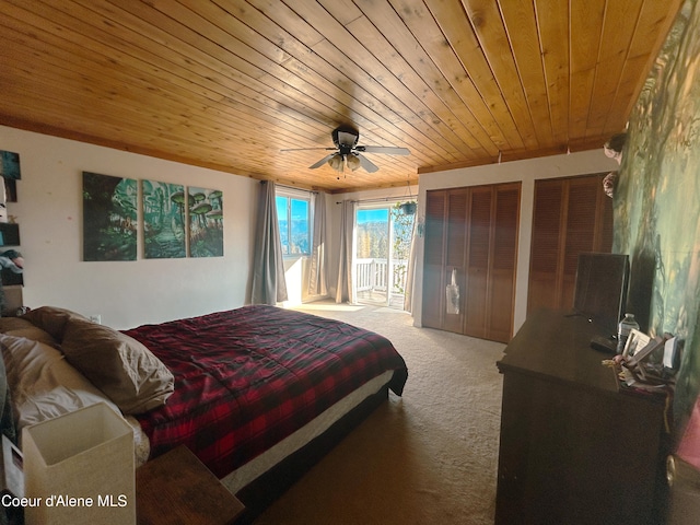 carpeted bedroom featuring wood ceiling and ceiling fan