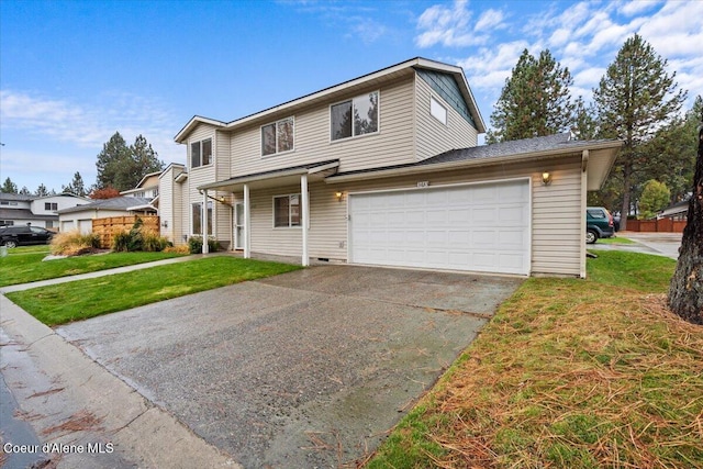 view of property with a front lawn and a garage