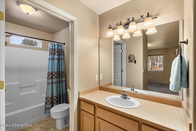 full bathroom featuring toilet, shower / tub combo with curtain, vanity, and plenty of natural light