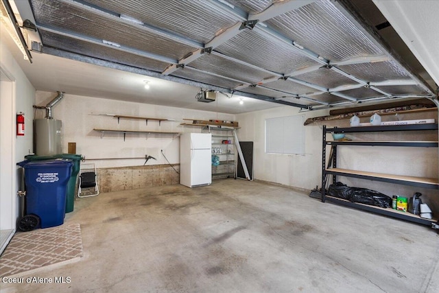 garage with water heater, white fridge, and a garage door opener