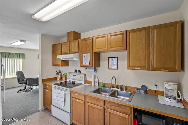 kitchen featuring sink, stainless steel refrigerator, and white electric stove