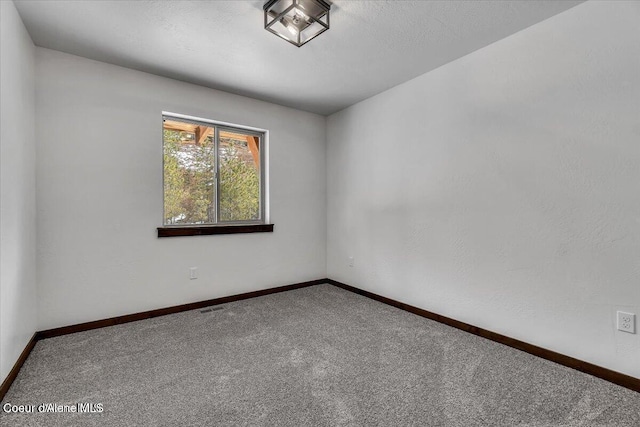 unfurnished room with carpet floors