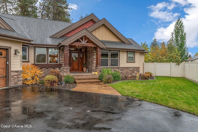 craftsman inspired home with a front yard