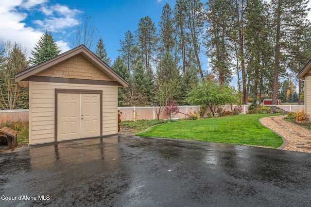 garage featuring a lawn