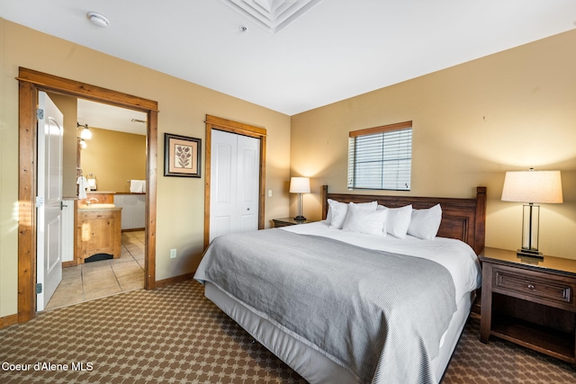 bedroom with light tile patterned floors and a closet