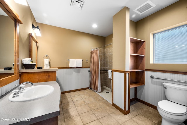 bathroom featuring a shower with shower curtain, tile patterned floors, sink, and toilet