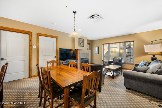 view of carpeted dining area