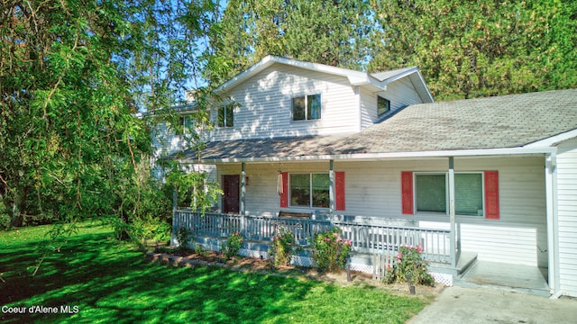 front facade with a front lawn and a porch