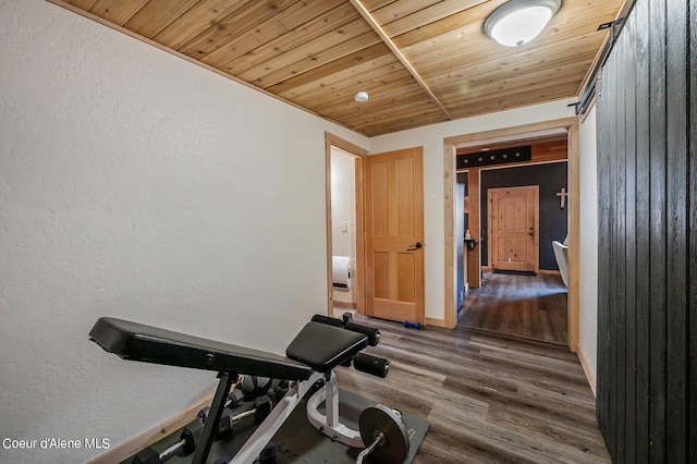 workout area with wood ceiling and dark hardwood / wood-style flooring