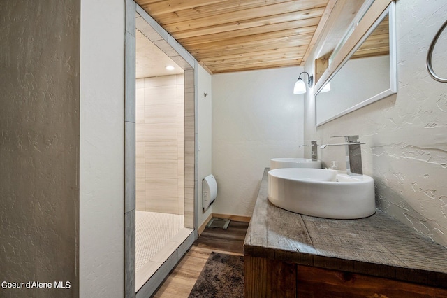 bathroom featuring vanity, hardwood / wood-style flooring, wood ceiling, and walk in shower