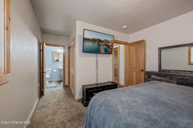 carpeted bedroom with ensuite bathroom