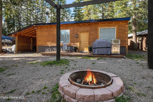 view of outdoor structure featuring a fire pit