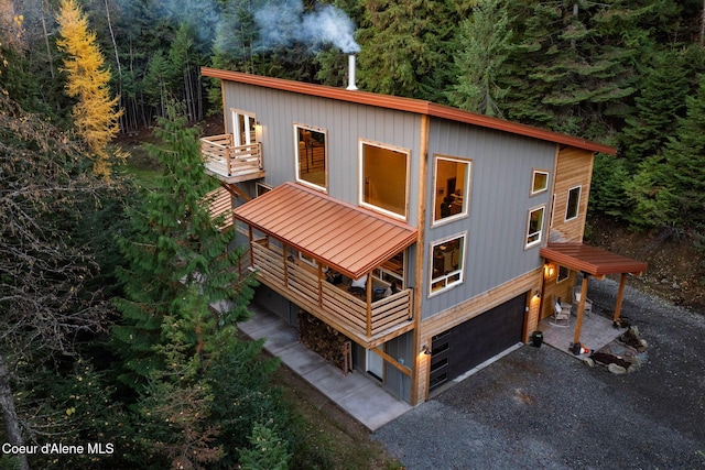 exterior space featuring a balcony and a garage