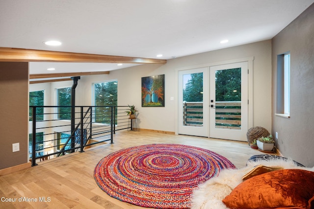 sitting room featuring french doors and light wood-type flooring