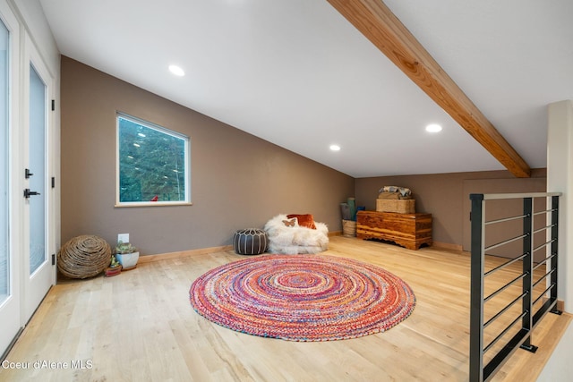 interior space with beamed ceiling and wood-type flooring