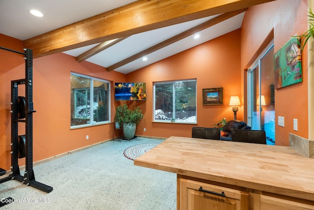 home office with lofted ceiling with beams