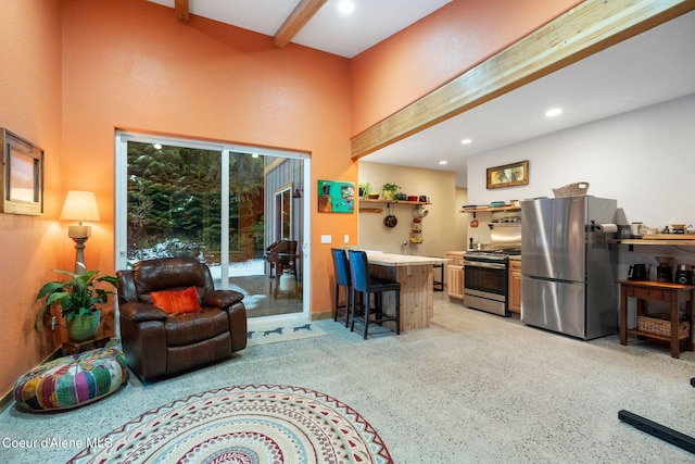 living room with beam ceiling and a towering ceiling