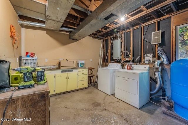 14895 N Crystal Springs Ln, Rathdrum, ID 83858 - basement with separate washer and dryer, a water pressure tank, and water heater