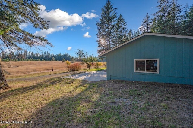 14895 N Crystal Springs Ln, Rathdrum, ID 83858 - view of side of home with a lawn