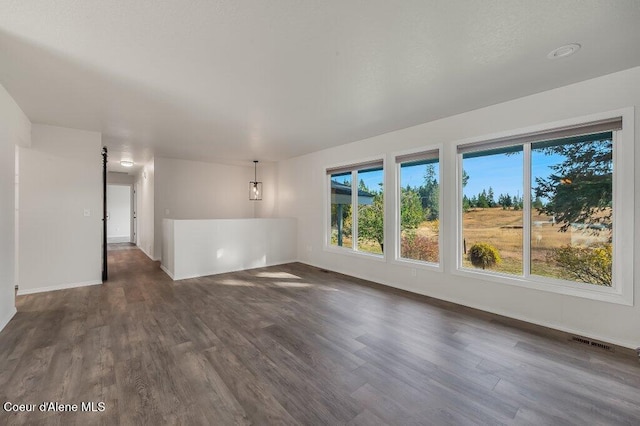 14895 N Crystal Springs Ln, Rathdrum, ID 83858 - spare room with dark wood-style flooring and baseboards
