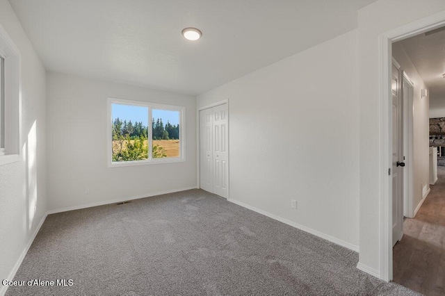 14895 N Crystal Springs Ln, Rathdrum, ID 83858 - unfurnished bedroom featuring carpet flooring, baseboards, and a closet