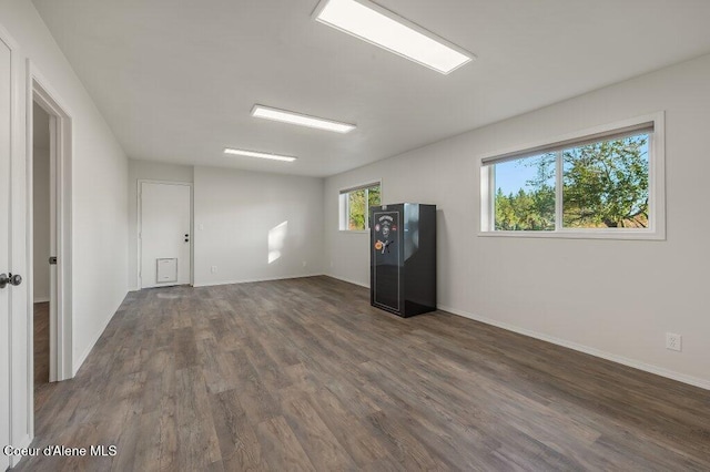14895 N Crystal Springs Ln, Rathdrum, ID 83858 - empty room with dark wood-style flooring and baseboards
